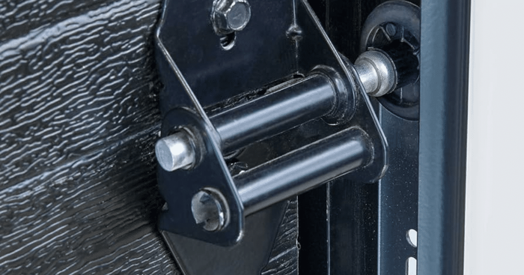 Close-up of a garage door roller and hinge mechanism.